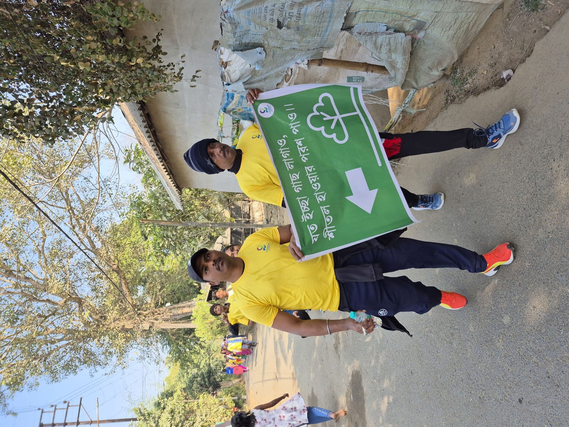 Walkers carrying environmental awareness banner